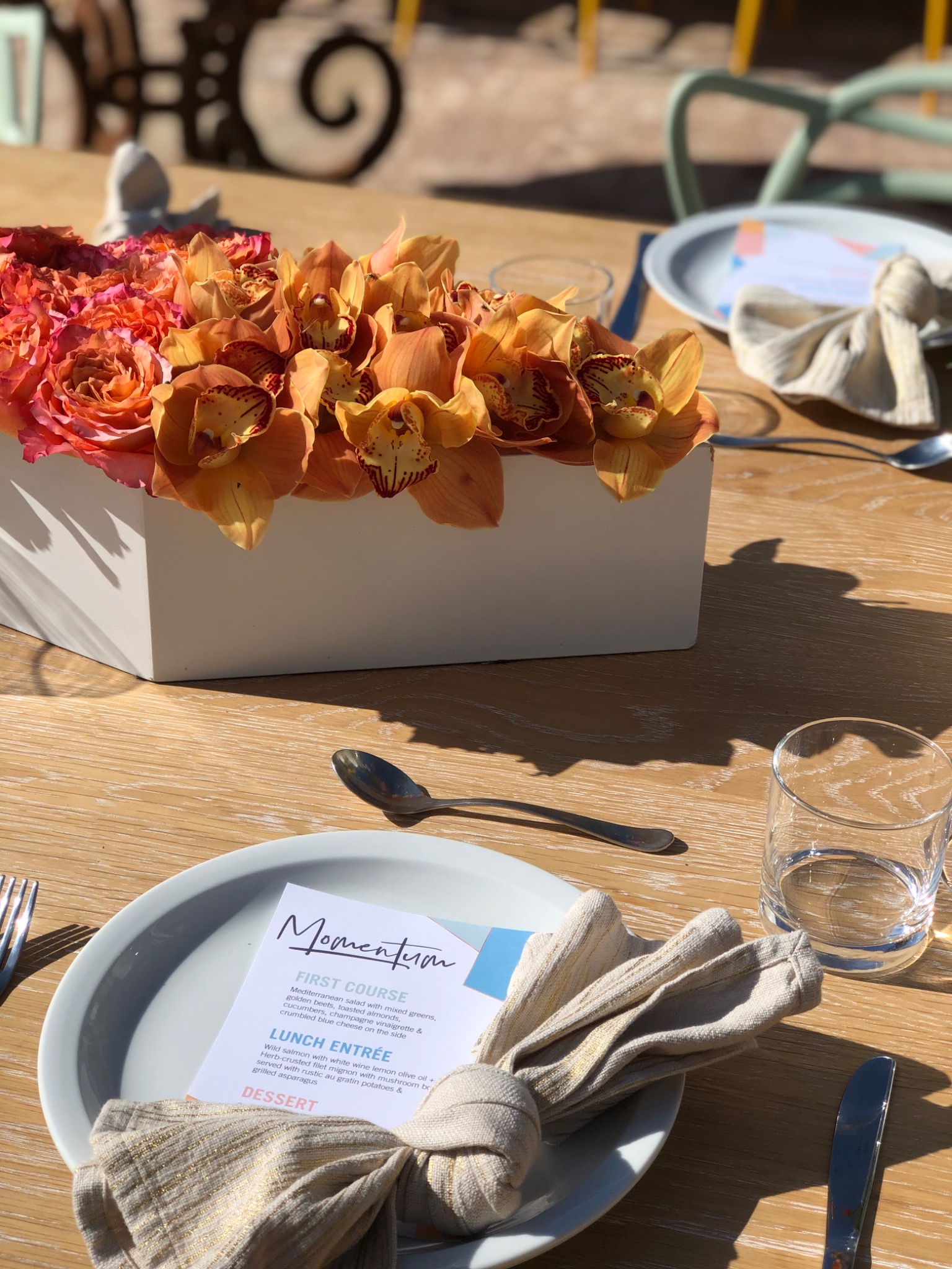 Bright floral tablescape with a custom menu